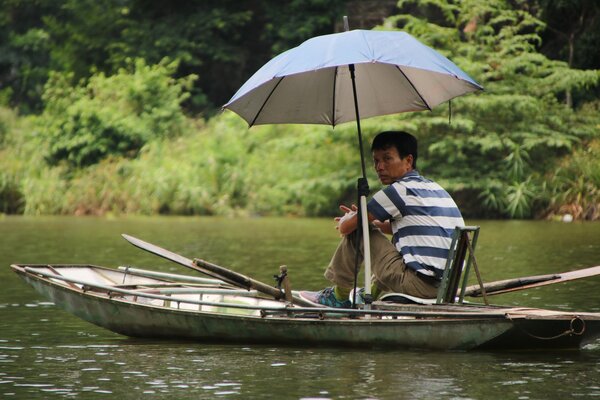 fisherman with umbrella-min