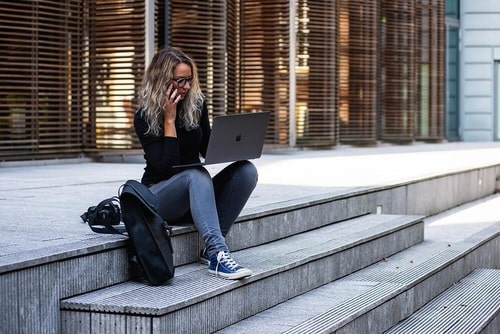 girl-laptop-phone-min